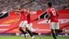 Anthony Martial, à gauche, de Manchester United, fait la fête après avoir marqué le deuxième but de son équipe contre Southampton à Old Trafford, à Manchester, en Angleterre, le lundi 13 juillet 2020. 