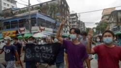 Anti-coup protesters flash the three-finger salute during a demonstration against the military takeover, in Yangon, Myanmar, Monday, May 24, 2021. (AP Photo)