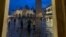 FILE - Tourists are seen in Venice's iconic St. Mark's Square after November floodwaters receded. (Sabina Castelfranco/VOA)