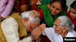 Sometimes, even world leaders have to get permission from the mothers. Here, Hindu nationalist Narendra Modi, India's new prime minister, seeks blessings from his mother.