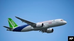 FILE - A China's Comac C919 aircraft performs during first day of Singapore Airshow in Singapore, Tuesday, Feb. 20, 2024. 