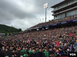Not an empty seat could be seen in Liberty University's football stadium as new graduates and others gathered to hear from President Donald Trump. (C. Presutti/VOA)
