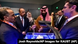 Saudi Crown Prince Mohammed bin Salman view a showing of Saudi Arabian technology, including an exhibit by King Abdullah University of Science and Technology, during a visit to Massachusetts Institute of Technology on Saturday, March 24, 2018.
