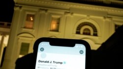 A photo illustration shows the suspended Twitter account of U.S. President Donald Trump on a smartphone and the White House in Washington, U.S., January 8, 2021. REUTERS/Joshua Roberts