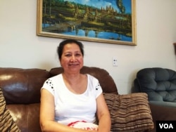 Kang Sopha, a 70-year-old, retired Cambodian resident of Oakland who has voted by mail in California's primary elections in June talks to VOA Khmer at her home, September 7, 2016. Although she became a US citizenship in 2005, Kang Sopha has not voted in the last two presidential elections. The Oakland resident is finally voting in this year's presidential election, by mail. (Sophat Soeung/VOA Khmer)