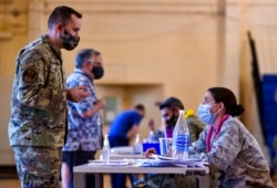 FILE - Hickam 15th Medical Group host the first COVID-19 mass vaccination on Joint Base Pearl Harbor-Hickam, in this Feb. 9, 2021, photo provided by the Department of Defense.