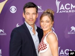 This April 1, 2012 file photo shows country singer LeAnn Rimes, right, and her husband Eddie Cibrian at the 47th Annual Academy of Country Music Awards in Las Vegas.