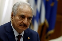Libyan commander Khalifa Haftar meets Greek Prime Minister Kyriakos Mitsotakis (not pictured) at the Parliament in Athens, Greece, Jan. 17, 2020.