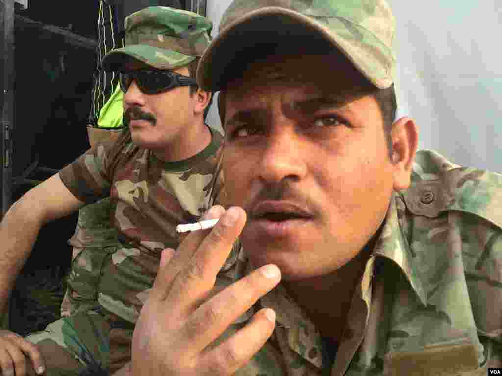 Iraqi soldiers rest at a base not far from Mosul in a camp occupied by IS only last month near Qayyarah, Iraq, Oct. 24, 2016. (H. Murdock/VOA)