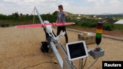 A Zipline engineer prepares a a drone for test flight at an operations base in Muhanda, south of Rwanda's capital, Kigali. Zipline, a California-based robotics company, delivered its first blood to patients using a drone, Oct. 12, 2016.