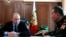 FILE - Russian President Vladimir Putin, left, and General Viktor Zolotov, commander of Interior Ministry troops, confer in the Kremlin in Moscow, April 5, 2016. Zolotov is slated to lead the new National Guard.