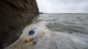 Rubbish including discarded plastic bottles and food wrappers, is pictured floating on the water surface in the Marine Lake at West Kirby in northwest England on April 22, 2024.
