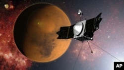 Interprétation par un artiste de la sonde MAVEN de la NASA (AP)