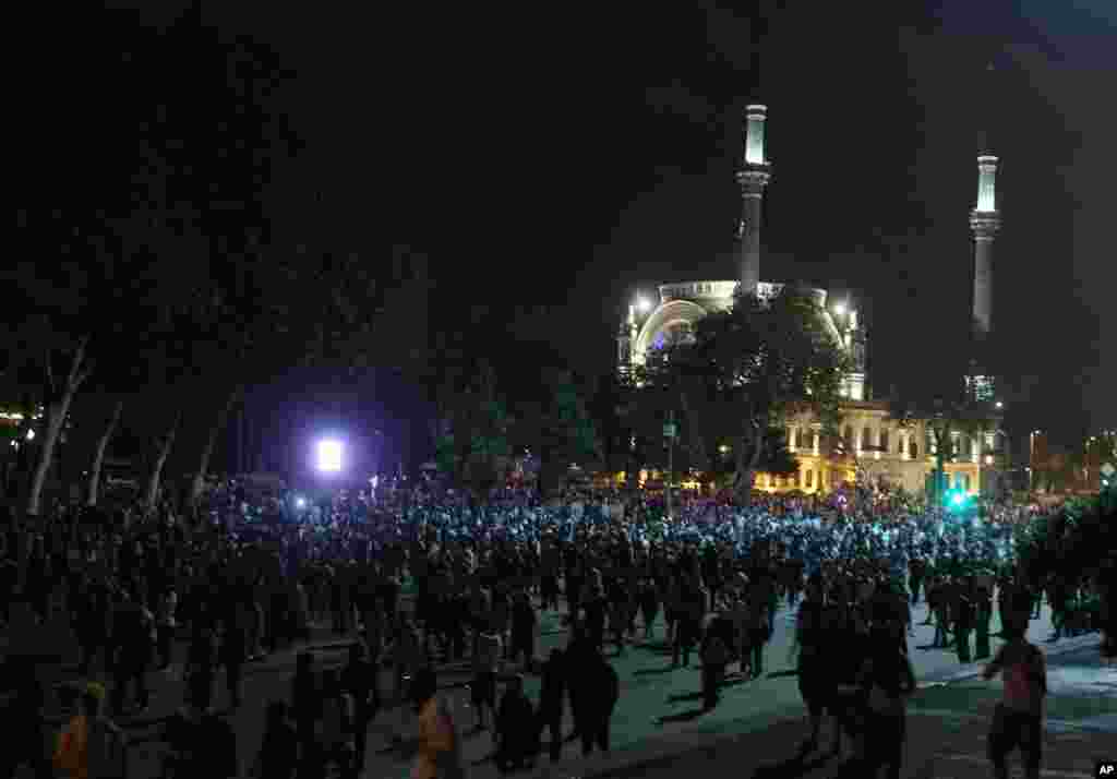 Protesters gather in front of Dolmabache mosque during the third day of nationwide anti-government protest in Istanbul, June 2, 2013. 