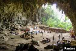 Archaeological excavations of Holocene deposits at Liang Bua on the Indonesian island of Flores are seen in progress in this undated handout picture courtesy of the Liang Bua Team.