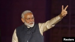 Indian Prime Minister Narendra Modi gestures toward his supporters after the election results at Bharatiya Janata Party (BJP) headquarter in New Delhi, India, May 23, 2019.