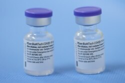 Switzerland, Geneva, Vials of the Pfizer-BioNTech vaccine are pictured in a vaccination centreVials of the Pfizer-BioNTech vaccine are pictured in a vaccination centre