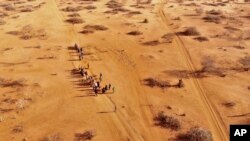 FILE - People arrive at a displacement camp on the outskirts of Dollow, Somalia on Septemer 21, 2022 amid a drought. (AP Photo/Jerome Delay, File)