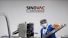 A man works in the packaging facility of Chinese vaccine maker Sinovac Biotech, developing an experimental coronavirus disease (COVID-19) vaccine, in Beijing, China, Sept. 24, 2020.