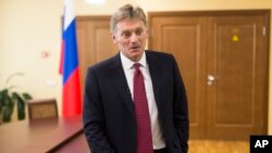FILE - President Vladimir Putin’s spokesman Dmitry Peskov speaks to a reporter in Moscow.