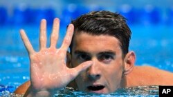 Michael Phelps gestures after winning the men's 200-meter butterfly at the U.S. Olympic swimming trials, Wednesday, June 29, 2016, in Omaha, Neb. Phelps qualified for his fifth Summer Games. 