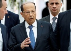FILE - Lebanese President Michel Aoun gestures upon his arrival at Tunis-Carthage International Airport in Tunis, Tunisia, March 30, 2019.