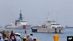 The U.S. Coast Guard National Security Cutter Bertholf (WMSL 750), left, and the Philippine Coast Guard ship BRP Batangas arrive Wednesday, May 15, 2019 in Manila, Philippines, after taking part in a joint exercise off the South China Sea. Capt…