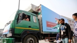 A pickup van carries Oxford-Astrazeneca COVID-19 vaccines, which arrived from India as a gift to Bangladesh, from the Hazrat Shahjalal International Airport to the storage house, in Dhaka, Bangladesh January 21, 2021.