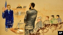 Omar Khadr (with beard) before a U.S. military commission, Oct. 25, 2010.