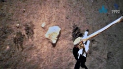 China's Chang'e-5 spacecraft collects lunar samples on the moon in this handout image provided by China National Space Administration (CNSA) December 3, 2020. (CNSA/Handout via REUTERS)