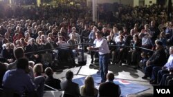 Romney en campaña en preparación del Super Martes tras asegurar la victoria en el estado de Washington.