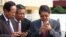FILE PHOTO - Senior Cambodian government officers are using their smartphones while awaiting the return of Cambodian Prime Minister Hun Sen from France at Phnom Penh International Airport.