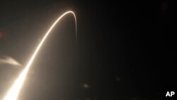 A Falcon 9 SpaceX rocket, with a payload of 60 satellites for SpaceX's Starlink broadband network, lifts off from Space Launch Complex 40 during a time exposure at the Cape Canaveral Air Force Station in Cape Canaveral, Fla., May 23, 2019. 