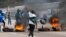 Supporters of former South African President Jacob Zuma block the freeway with burning tyres during a protest in Peacevale, South Africa, July 9, 2021. REUTERS/Rogan Ward