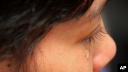 Cambodian maid Hok Pov, 31, cries as she speaks during an interview in Petaling Jaya, near Kuala Lumpur, Malaysia. (August 16, 2011)