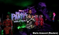 FILE - Cast member Chadwick Boseman poses at the premiere of "Black Panther" in Los Angeles, California, Jan. 29, 2018.