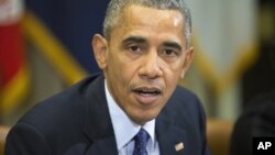 ፋይል ፎቶ - ፕረዝዳንት ኦባማ በዋይት ሃውስ ስብሰባ እያካሄደ 