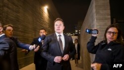 Elon Musk leaves the U.S. District Court, Central District of California through a back door in Los Angeles, Dec. 3, 2019. The defamation lawsuit against the Tesla CEO began over calling British cave explorer Vernon Unsworth "Pedo Guy" and child rapist.