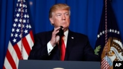 FILE - President Donald Trump speaks at Mar-a-Lago in Palm Beach, Florida, April 6, 2017, after the U.S. fired a barrage of cruise missiles into Syria in retaliation for a gruesome chemical weapons attack against civilians.