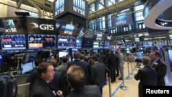 Residents and firefighters carry a Black Nazarene statue from a burning house after a fire hit an informal settlement in Manila, Philippines.