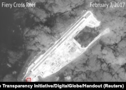 A satellite image shows what CSIS Asia Maritime Transparency Initiative says appears to be concrete structures with retractable roofs on the artificial island Fiery Cross reefs, South China Sea, in this image released on February 22, 2017.