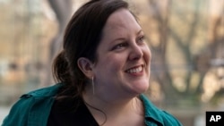 Emily Hollenbeck stands for a portrait at the American Museum of Natural History's Rose Center in New York on Jan. 12, 2024. (AP Photo/Mary Conlon)