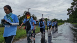 Young Cambodians who took part in the biking campaign decided to walk after the Kok Kong police interrupted their campaign taking away their bikes as they intended to bike from Koh Kong to Phnom Penh to submit a petition to have "Kok Kong Krav Island" a protected area, in Koh Kong province, June 3, 2020. (Courtesy photo of Alex Gonzalez Davidson)