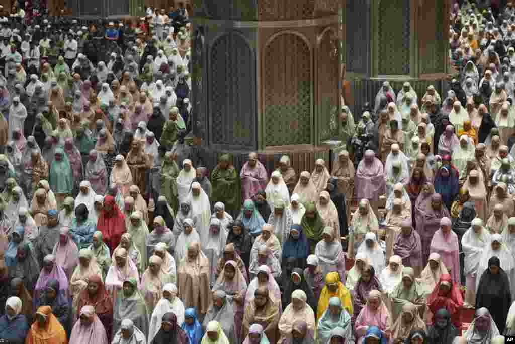 Indonesian Muslims pray an evening prayer called "tarawih" to mark the first eve of the holy fasting month of Ramadan, at Istiqlal Mosque in Jakarta, Indonesia.