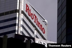 FILE PHOTO: A sign adorns the building where mining company Rio Tinto has their office in Perth, Western Australia
