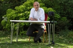 FILE - Dominic Cummings, senior aide to Prime Minister Boris Johnson, makes a statement over allegations he breached coronavirus lockdown restrictions, London, May 25, 2020.