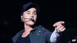 Recording artist Justin Bieber performs at the 2015 Billboard Hot 100 Music Festival at Nikon at Jones Beach Theater in Wantagh, New York.