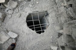 Athari ya roketi iliyotua katika kambi ya kikosi cha anga cha Al Asaad cha majeshi ya ushirika yanayo ongozwa na Marekani, Iraq