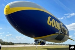 The Goodyear Blimp is prepared for takeoff, February 12, 2025, in New Smyrna Beach, Florida. (AP Photo/Mark Long)