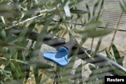 The drip irrigation system with which a farm waters its olive trees is pictured, as Tuscany's famed wine and olive oil industry suffers from a heatwave and drought, in Greve in Chianti, Italy, July 29, 2022. (REUTERS/Jennifer Lorenzini)